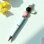 White Pen Pink Cow Charm